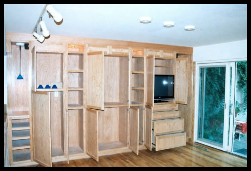 14ft Red Oak custom entertainment center with integrated LED lighting; massive storage capacity and open shelving.
