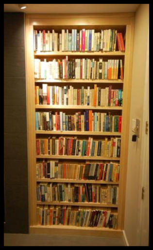 Design-Focused: Custom white maple built-in designed for a wall niche, featuring 1-inch thick adjustable shelving and a floor-to-ceiling 8-foot height.