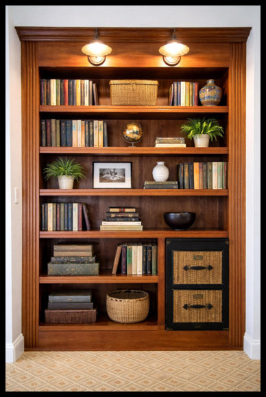 8ft tall custom Cherry wood built-in bookcase with wide fluted vertical moldings and 1.5-inch thick fluted shelving.